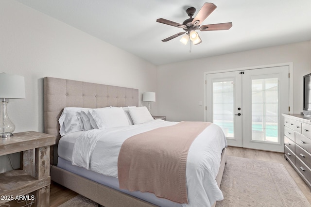 bedroom featuring access to exterior, ceiling fan, french doors, and light wood-style floors