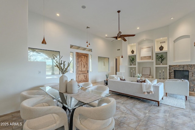 28423 N 139th St, Scottsdale, AZ 85262 - living room featuring a fireplace, built in shelves, recessed lighting, and a ceiling fan