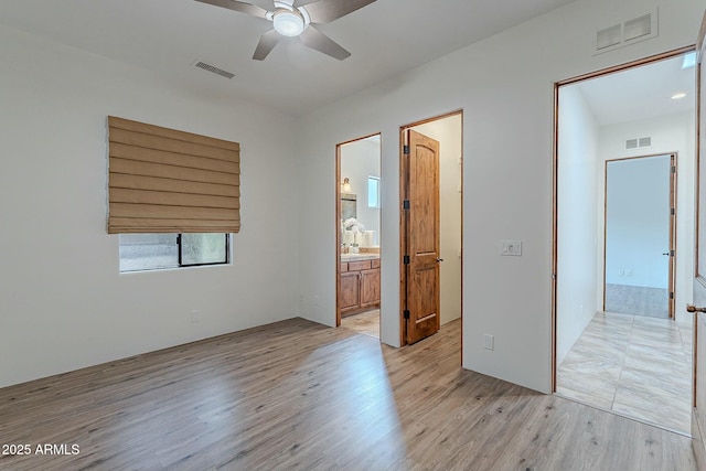28423 N 139th St, Scottsdale, AZ 85262 - unfurnished bedroom with visible vents, light wood-style floors, and ensuite bathroom