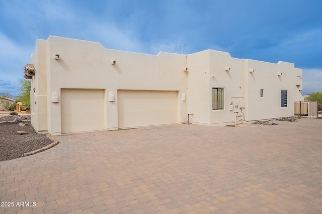28423 N 139th St, Scottsdale, AZ 85262 - view of front of house with stucco siding, an attached garage, fence, and decorative driveway