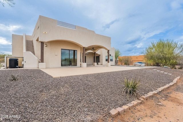 28423 N 139th St, Scottsdale, AZ 85262 - rear view of house featuring stucco siding, a ceiling fan, and a patio area