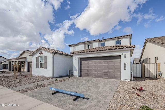 mediterranean / spanish house featuring a garage