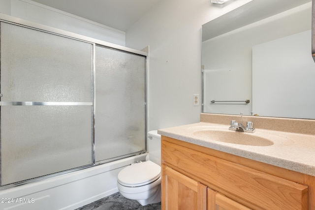 bathroom featuring shower / bath combination with glass door, vanity, and toilet