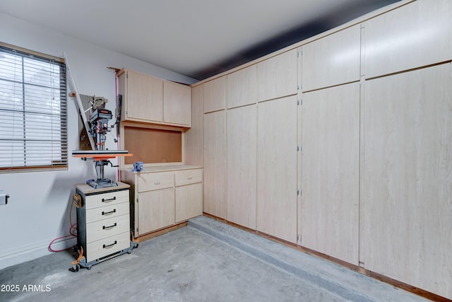 garage featuring baseboards