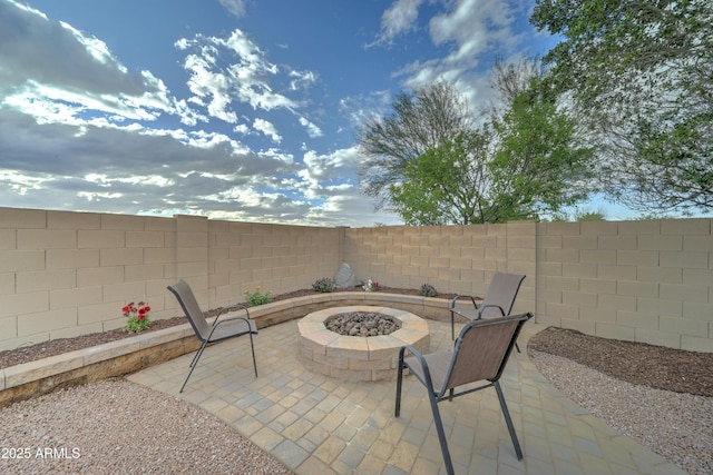 view of patio / terrace featuring a fire pit and a fenced backyard