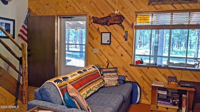 702 Mule Springs Trl, Forest Lakes, AZ 85931 - sitting room with wood walls and stairs