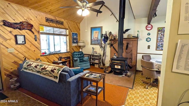 702 Mule Springs Trl, Forest Lakes, AZ 85931 - living room with a wood stove, wooden walls, ceiling fan, and vaulted ceiling