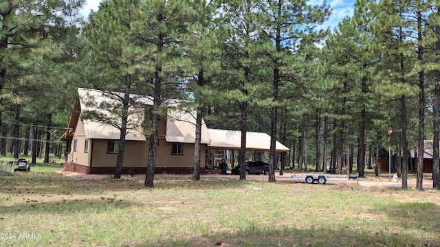 702 Mule Springs Trl, Forest Lakes, AZ 85931 - view of yard featuring a carport and a view of trees