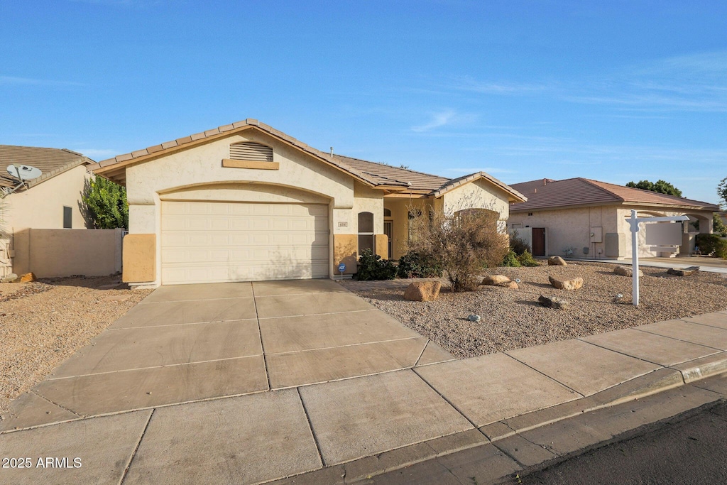 ranch-style home with a garage