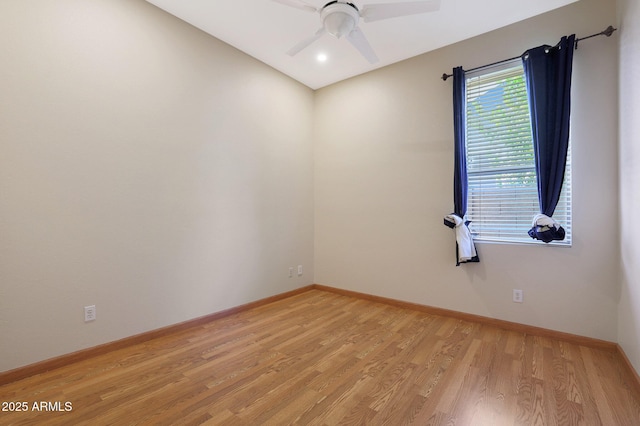 empty room featuring ceiling fan and light wood-type flooring