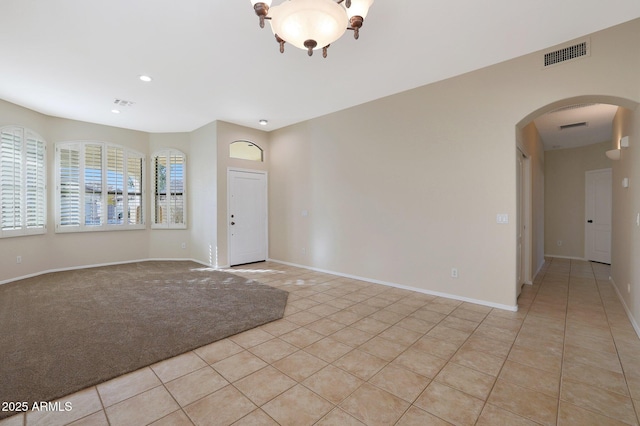 spare room with light tile patterned floors