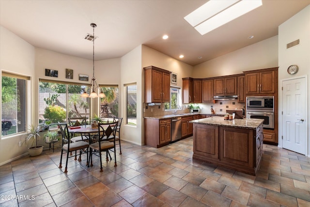 1922 E Everett Dr, Phoenix, AZ 85022 - kitchen with appliances with stainless steel finishes, high vaulted ceiling, decorative backsplash, baseboards, and recessed lighting
