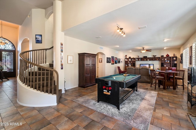 1922 E Everett Dr, Phoenix, AZ 85022 - recreation room featuring arched walkways, pool table, stone finish flooring, ceiling fan, and baseboards
