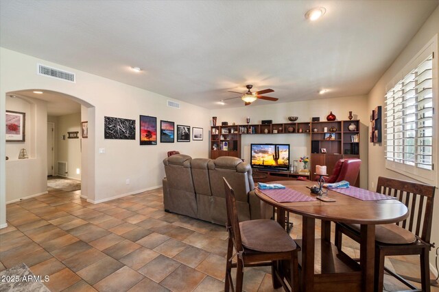 1922 E Everett Dr, Phoenix, AZ 85022 - dining area with arched walkways, ceiling fan, baseboards, and recessed lighting