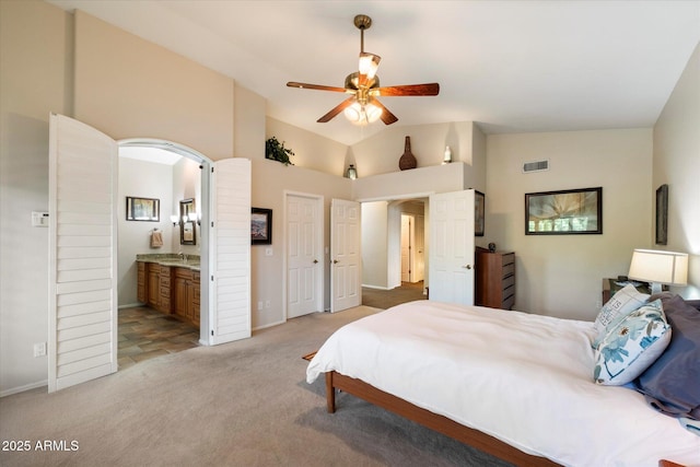 1922 E Everett Dr, Phoenix, AZ 85022 - bedroom with light colored carpet, vaulted ceiling, arched walkways, baseboards, and ensuite bathroom
