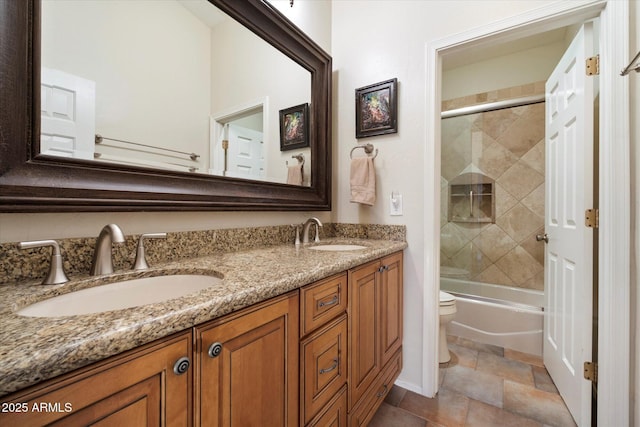 1922 E Everett Dr, Phoenix, AZ 85022 - full bath with toilet, double vanity, bath / shower combo with glass door, and stone finish floors
