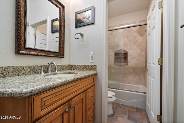 1922 E Everett Dr, Phoenix, AZ 85022 - full bath featuring toilet, vanity, bath / shower combo with glass door, and stone finish flooring