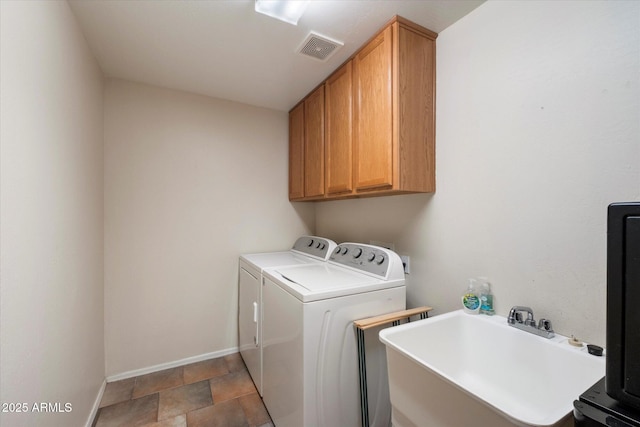 1922 E Everett Dr, Phoenix, AZ 85022 - washroom with separate washer and dryer, cabinet space, baseboards, and stone finish floors