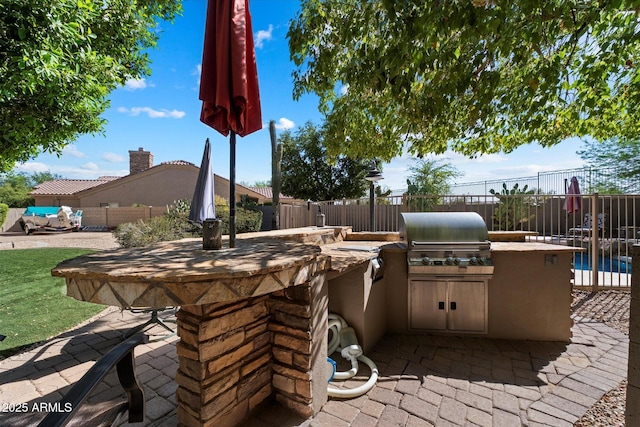 1922 E Everett Dr, Phoenix, AZ 85022 - view of patio / terrace featuring an outdoor kitchen, grilling area, and fence
