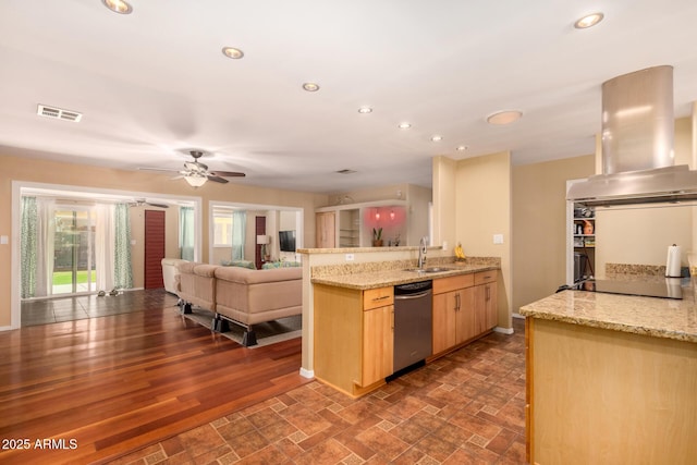 kitchen with light stone countertops, light brown cabinetry, stainless steel dishwasher, extractor fan, and sink