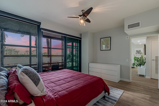 bedroom with light wood-type flooring and ceiling fan