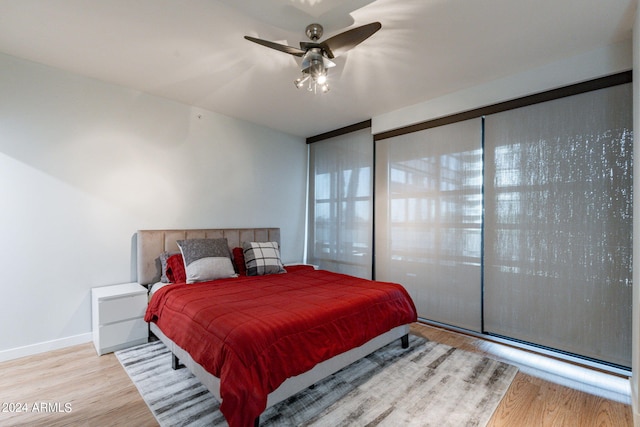 bedroom featuring light hardwood / wood-style floors and ceiling fan