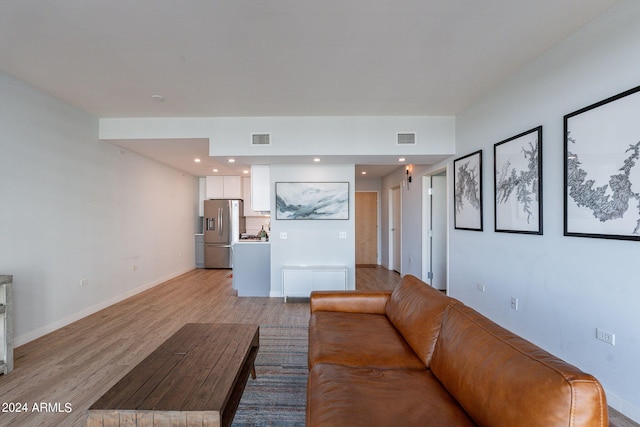 unfurnished living room with light hardwood / wood-style floors