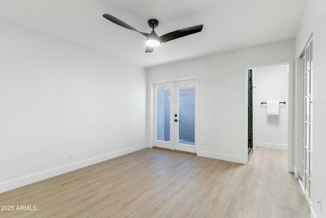 unfurnished room featuring french doors, ceiling fan, and light hardwood / wood-style flooring