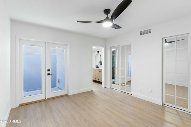 interior space featuring ceiling fan and light hardwood / wood-style floors