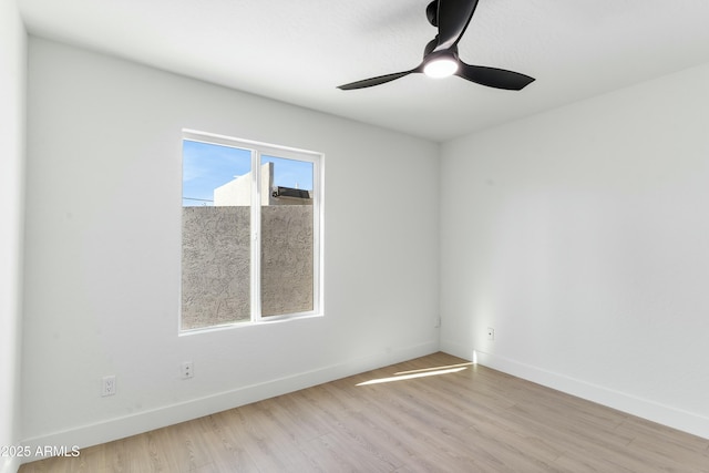 unfurnished room featuring ceiling fan and light wood-type flooring