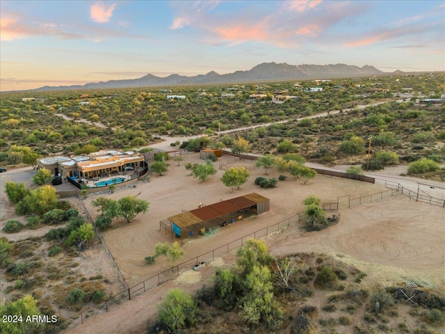 birds eye view of property featuring a mountain view