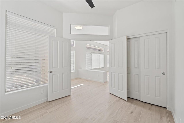 interior space with light wood-type flooring and baseboards