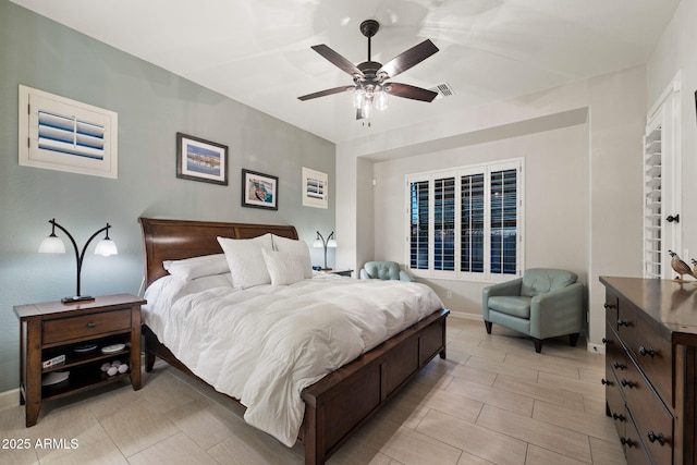 bedroom featuring a ceiling fan and visible vents