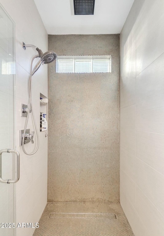 bathroom with a shower stall