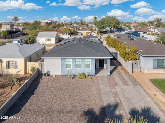 single story home with roof with shingles, a residential view, fence, and stucco siding