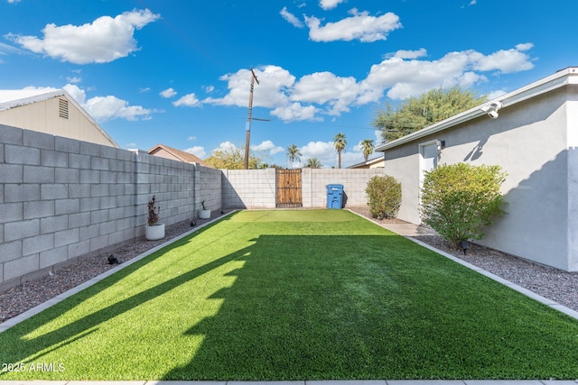 view of yard with a fenced backyard