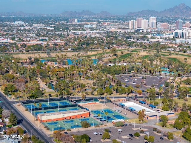 drone / aerial view featuring a view of city and a mountain view