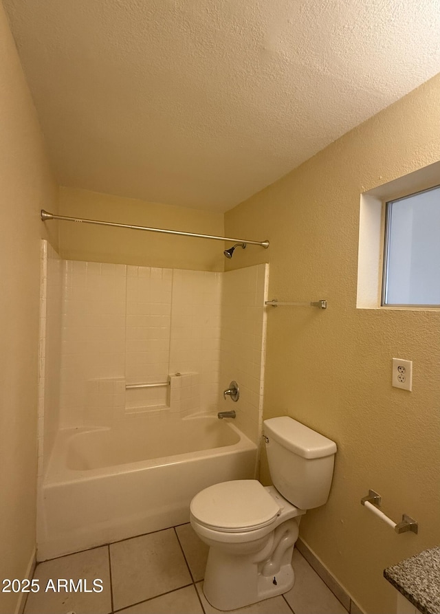 4913 W Maryland Ave, Glendale, AZ 85301 - bathroom featuring tile patterned flooring, bathtub / shower combination, a textured ceiling, and a textured wall