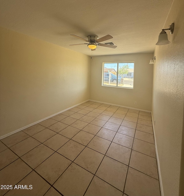 4913 W Maryland Ave, Glendale, AZ 85301 - spare room with light tile patterned floors, ceiling fan, and a textured ceiling