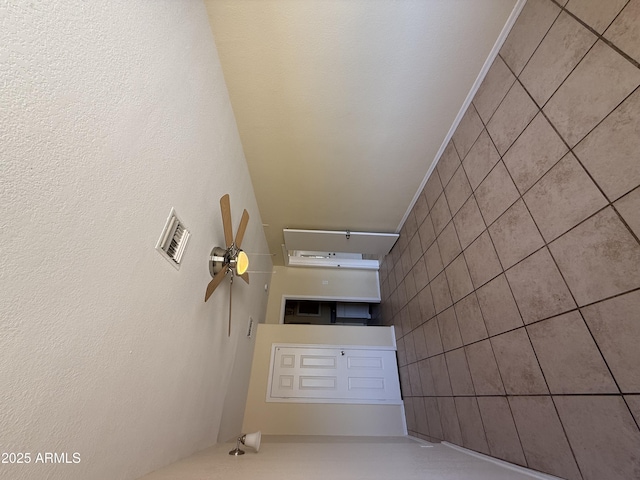 4913 W Maryland Ave, Glendale, AZ 85301 - unfurnished living room featuring ceiling fan and a textured wall
