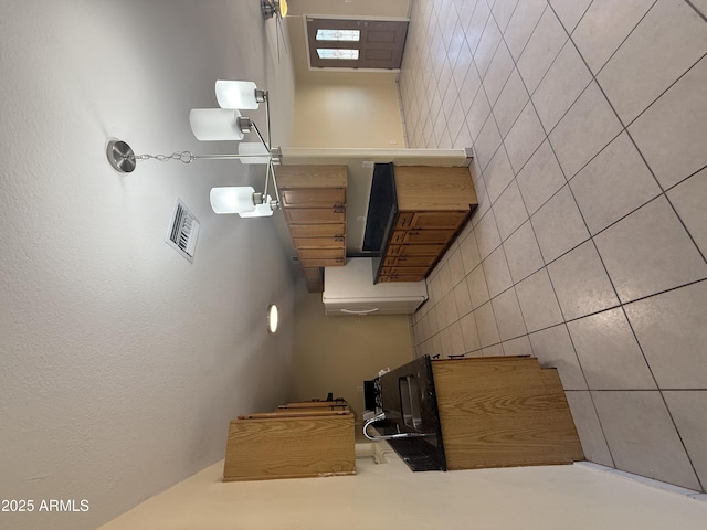 4913 W Maryland Ave, Glendale, AZ 85301 - unfurnished bedroom featuring tile walls