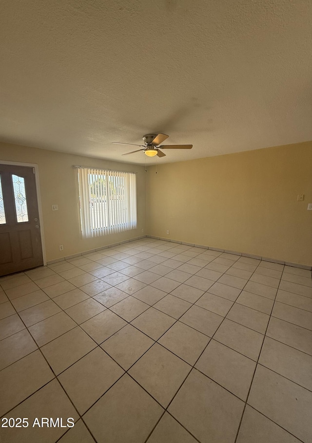 4913 W Maryland Ave, Glendale, AZ 85301 - spare room with light tile patterned flooring, a ceiling fan, and a textured ceiling