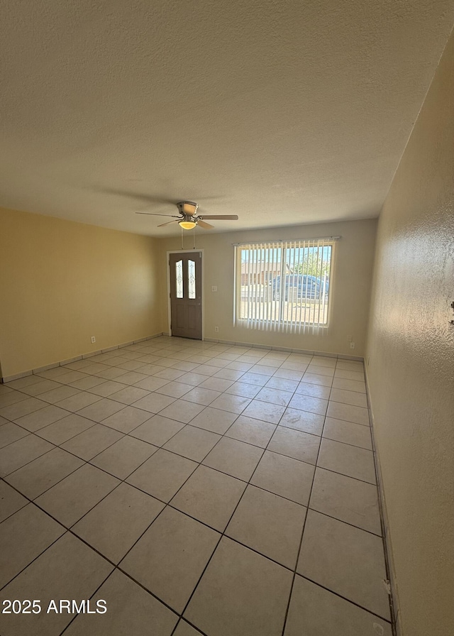4913 W Maryland Ave, Glendale, AZ 85301 - empty room with light tile patterned floors and a ceiling fan
