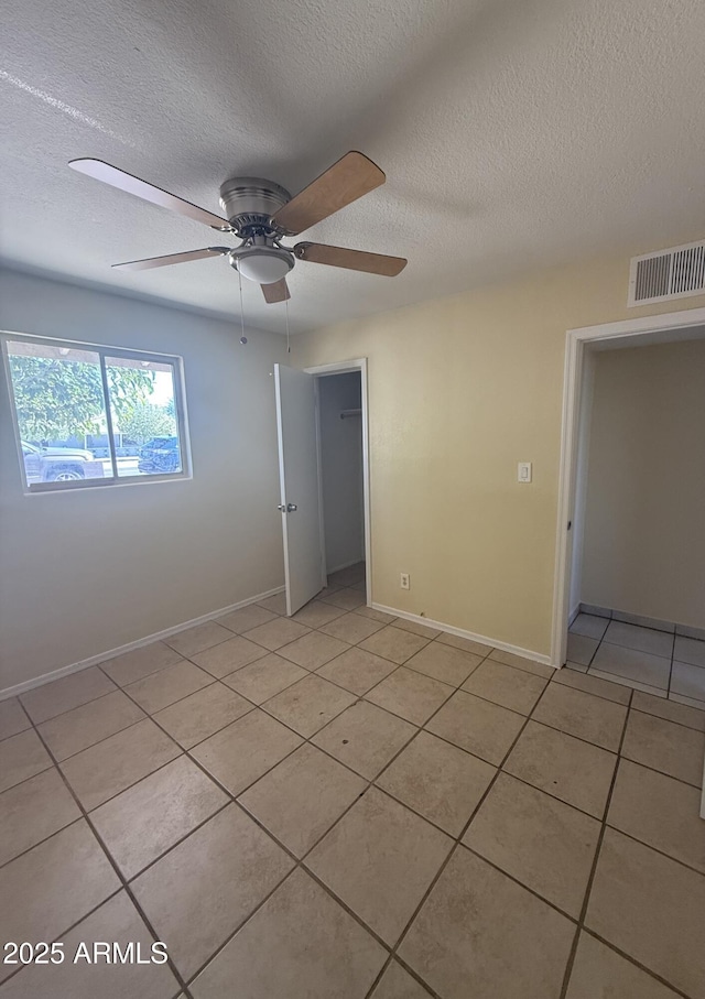 4913 W Maryland Ave, Glendale, AZ 85301 - unfurnished room featuring light tile patterned floors, a textured ceiling, and ceiling fan