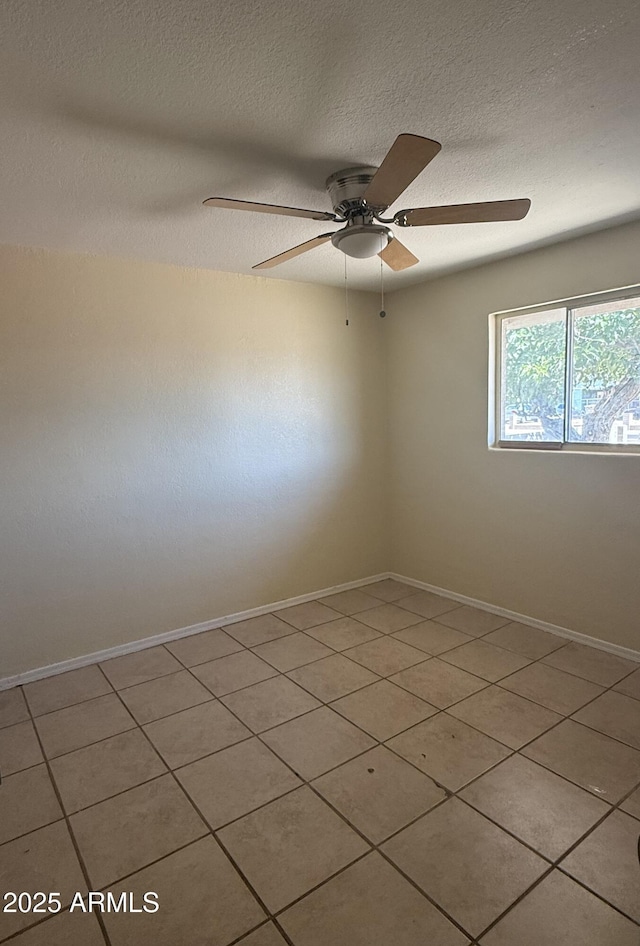 4913 W Maryland Ave, Glendale, AZ 85301 - spare room featuring a ceiling fan, a textured ceiling, and light tile patterned floors