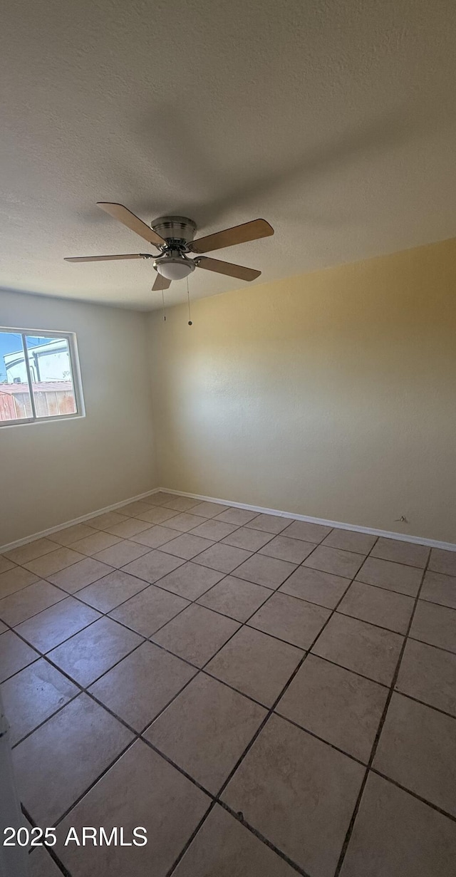 4913 W Maryland Ave, Glendale, AZ 85301 - spare room with tile patterned floors, a ceiling fan, and a textured ceiling