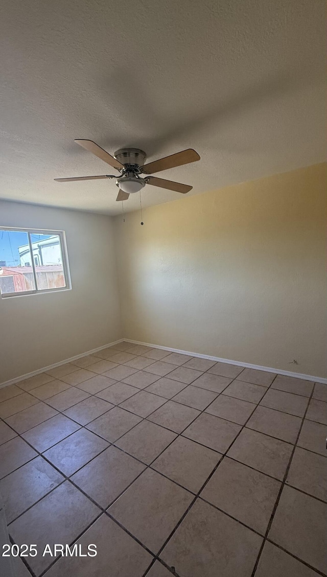 4913 W Maryland Ave, Glendale, AZ 85301 - tiled empty room featuring a textured ceiling and ceiling fan