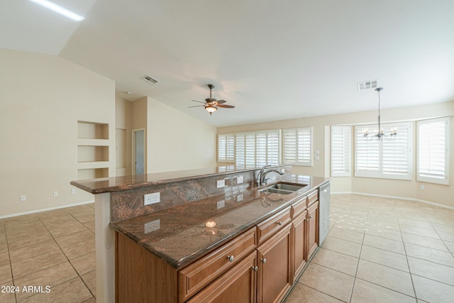 kitchen with a sink, visible vents, dishwasher, and brown cabinetry