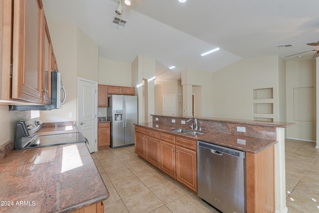 kitchen with visible vents, brown cabinets, an island with sink, a sink, and appliances with stainless steel finishes