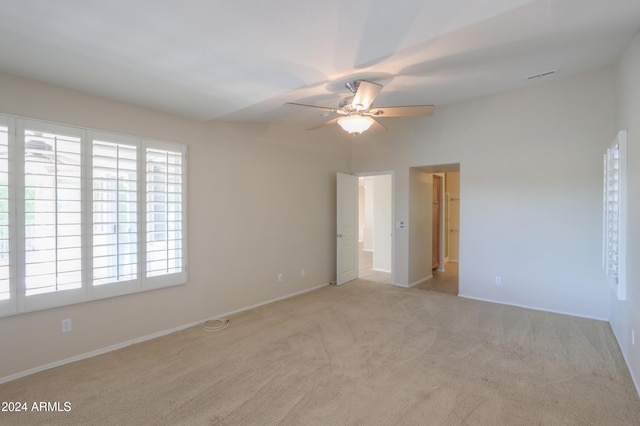 unfurnished room featuring a ceiling fan, visible vents, and carpet floors